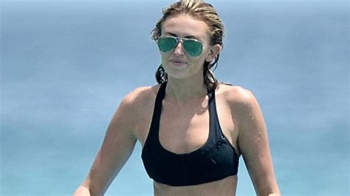 Paulina Gretzky Soaks In The Rays While Lounging In A Bikini In Her Pool 